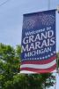 A sign welcomes visitors to downtown Grand Marais, Michigan. Photo by Joe Friedrichs